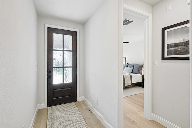 doorway to outside with light hardwood / wood-style flooring