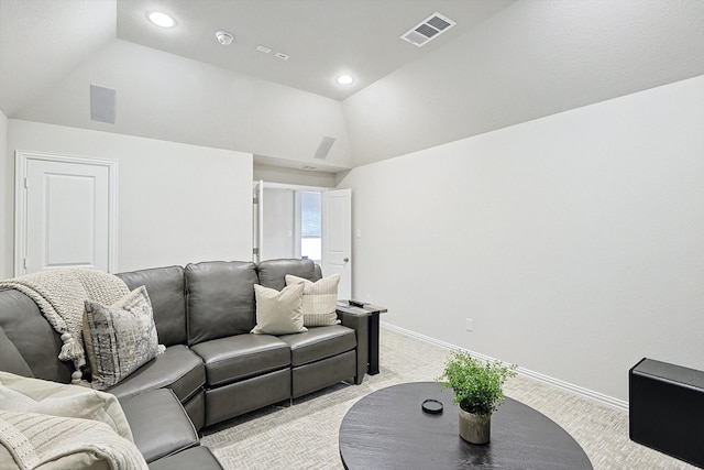 carpeted living room featuring vaulted ceiling