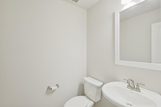 bathroom featuring sink and toilet