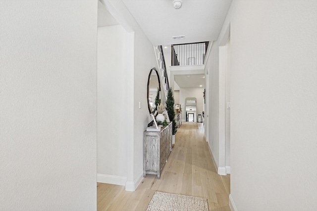 corridor featuring light hardwood / wood-style floors