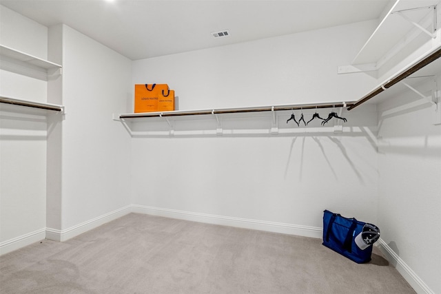 spacious closet featuring carpet floors and visible vents