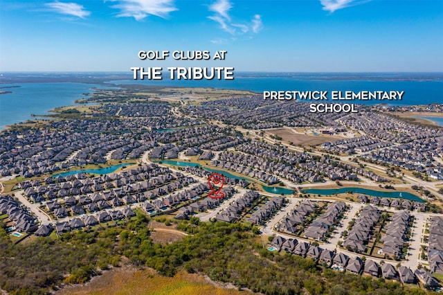 bird's eye view with a water view and a residential view