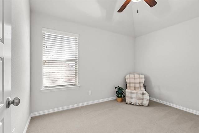 sitting room featuring vaulted ceiling, carpet, a ceiling fan, and baseboards