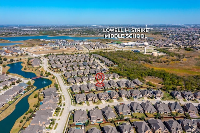 aerial view featuring a residential view and a water view