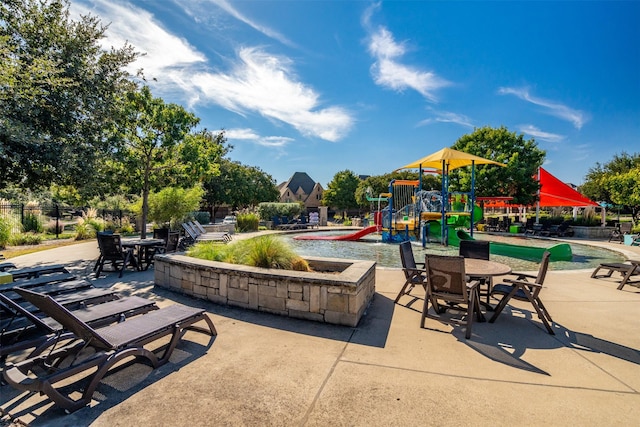 surrounding community featuring playground community and a patio