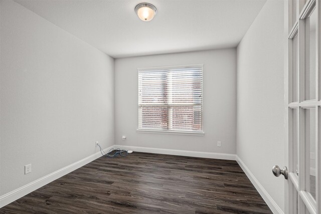 dining area featuring an inviting chandelier, hardwood / wood-style flooring, and a tray ceiling