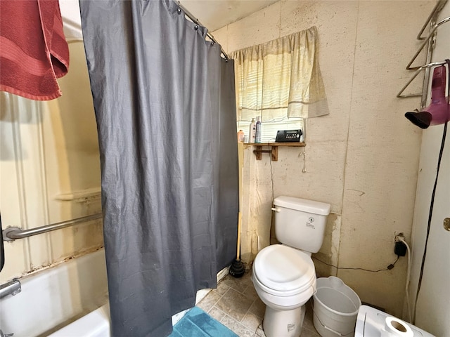 bathroom with toilet and shower / bath combo with shower curtain