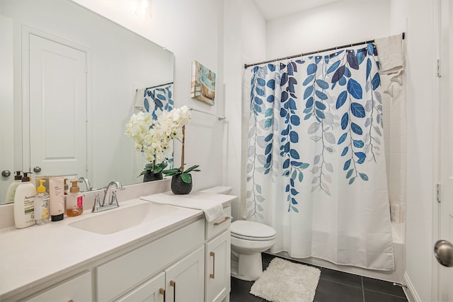 bathroom with vanity, toilet, and tile patterned floors