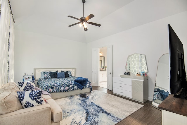 bedroom with dark hardwood / wood-style flooring, ensuite bath, vaulted ceiling, and ceiling fan