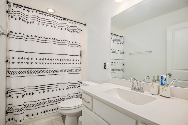 bathroom with vanity, toilet, and a shower with curtain