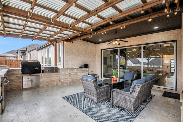 view of patio / terrace featuring area for grilling, a pergola, and ceiling fan