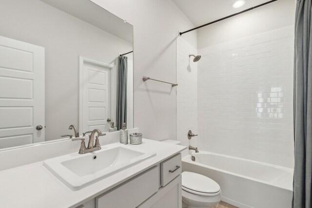 kitchen with hanging light fixtures, sink, stainless steel appliances, and white cabinetry