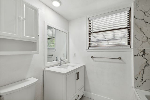 bathroom featuring vanity and toilet