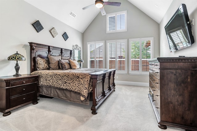 bedroom featuring light carpet, high vaulted ceiling, and ceiling fan