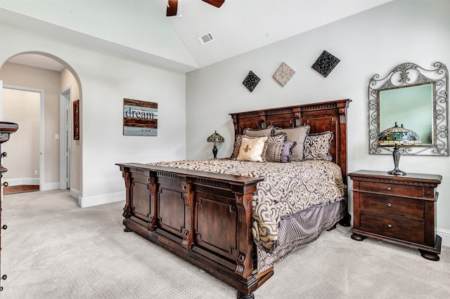 bedroom featuring lofted ceiling, light carpet, and ceiling fan