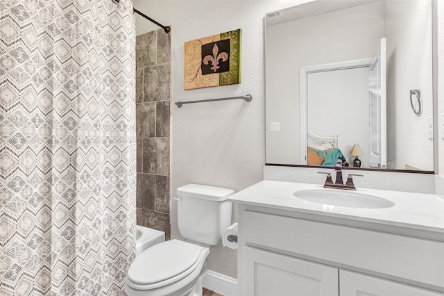 full bathroom featuring vanity, toilet, and shower / bath combination with curtain