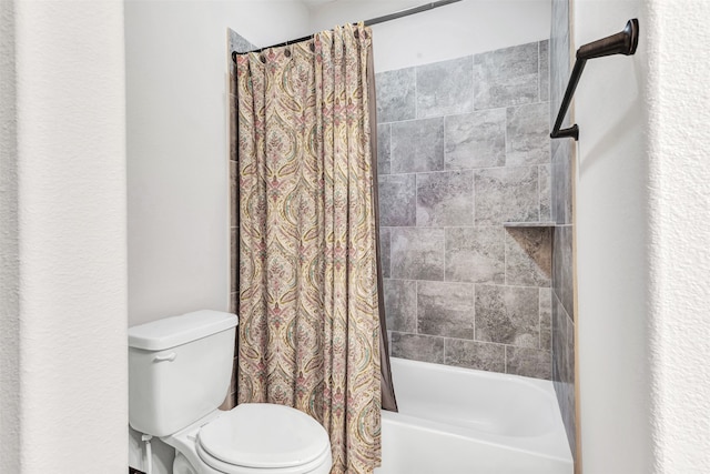 bathroom with shower / tub combo with curtain and toilet