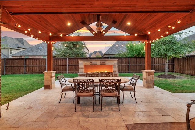 patio terrace at dusk with a yard