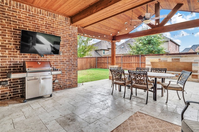 view of patio / terrace featuring area for grilling and ceiling fan