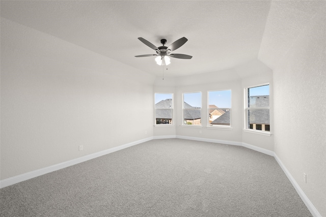 unfurnished room featuring ceiling fan, carpet, and a textured ceiling