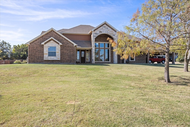 view of front facade with a front yard and a carport