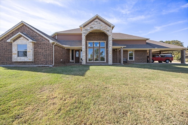 view of front facade featuring a front yard and a carport