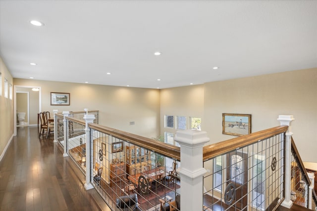 hall with dark hardwood / wood-style flooring