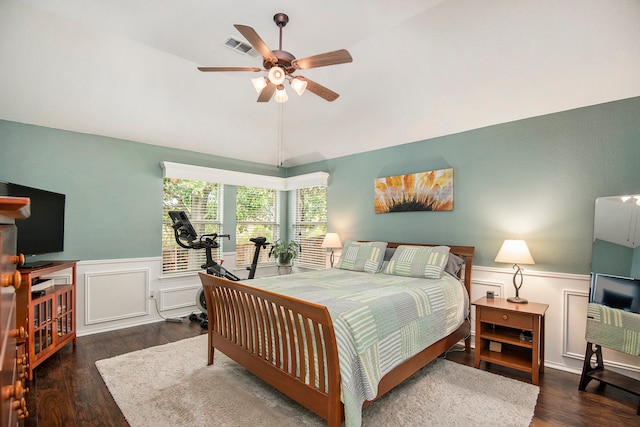 bedroom featuring dark hardwood / wood-style flooring, ceiling fan, and vaulted ceiling