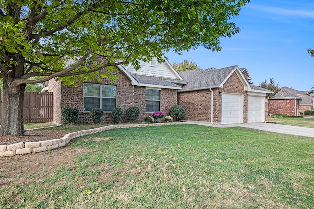 view of front of property featuring a garage and a front lawn