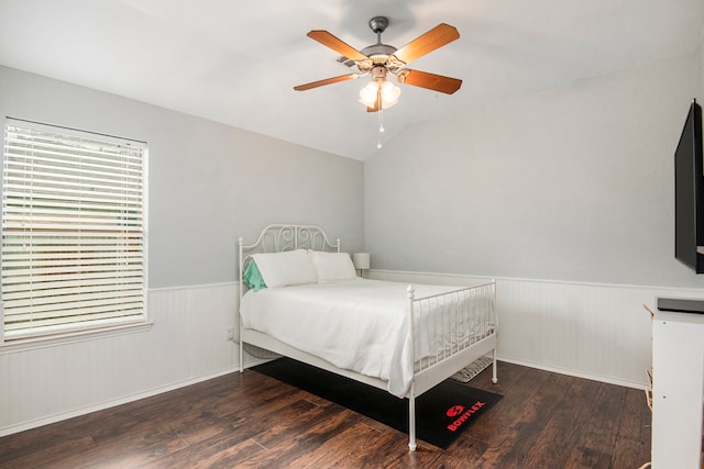 bedroom with dark wood-type flooring, ceiling fan, and vaulted ceiling