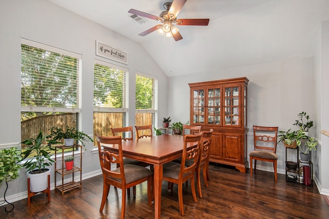 dining room with dark wood-type flooring, ceiling fan, and lofted ceiling