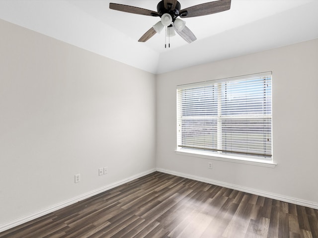 empty room featuring dark wood-type flooring and ceiling fan