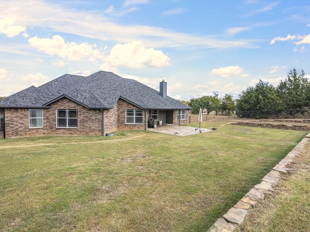 exterior space featuring a patio area and a lawn