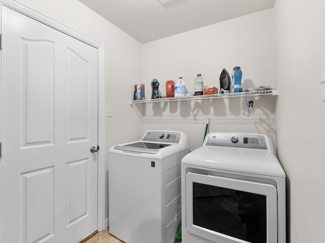 laundry area with independent washer and dryer