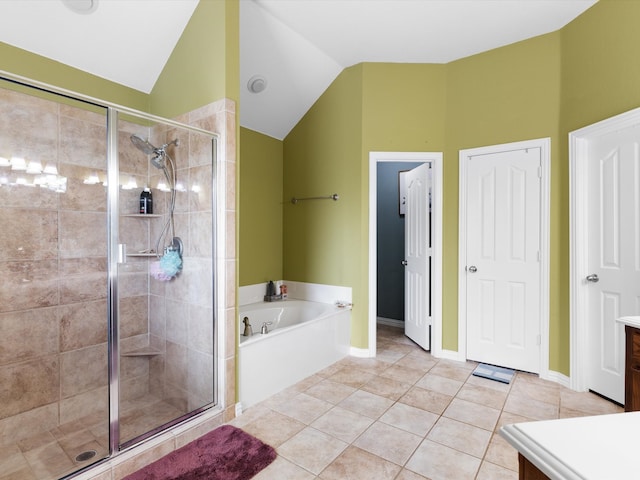 bathroom with vanity, tile patterned floors, vaulted ceiling, and shower with separate bathtub