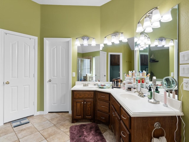 bathroom with vanity, tile patterned flooring, and a shower with door