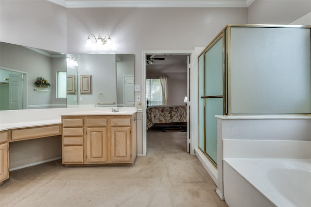 bathroom featuring vanity, crown molding, and shower with separate bathtub