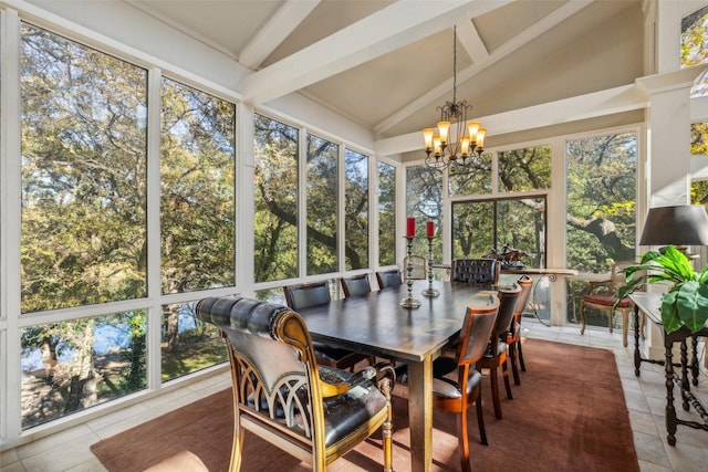 sunroom / solarium with an inviting chandelier, vaulted ceiling with beams, and a healthy amount of sunlight