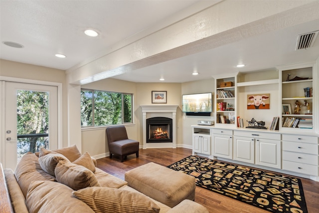 living room with dark hardwood / wood-style flooring