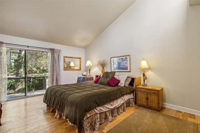 bedroom featuring high vaulted ceiling, access to exterior, and light wood-type flooring