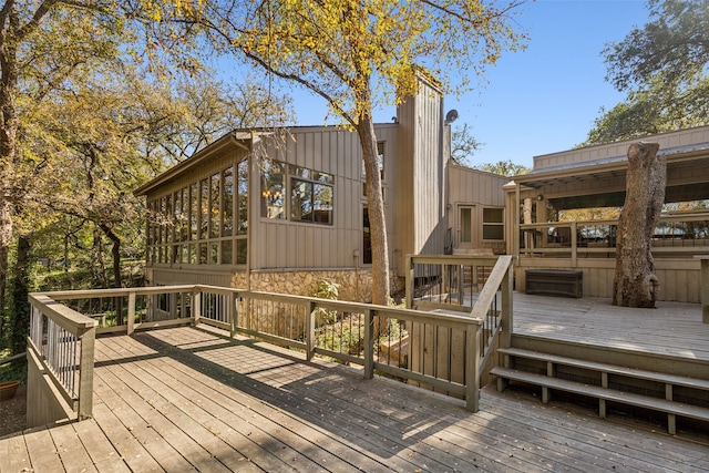 wooden terrace with a sunroom