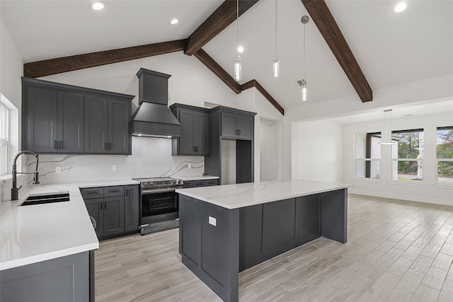 kitchen featuring custom range hood, sink, light hardwood / wood-style floors, a kitchen island, and stainless steel electric range