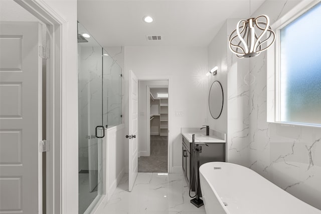 bathroom with shower with separate bathtub, vanity, and a wealth of natural light