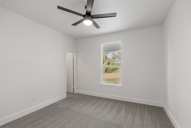 carpeted empty room with ceiling fan