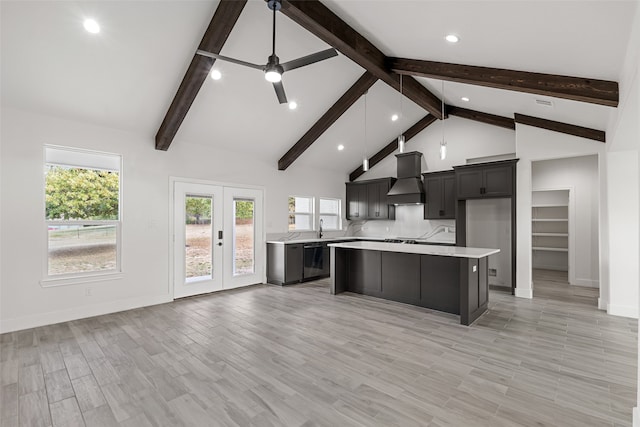 kitchen featuring beam ceiling, dishwasher, a center island, light hardwood / wood-style flooring, and custom range hood