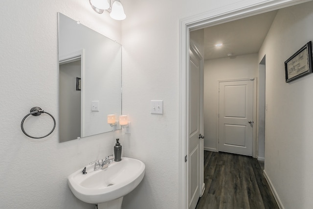 bathroom featuring sink and hardwood / wood-style flooring