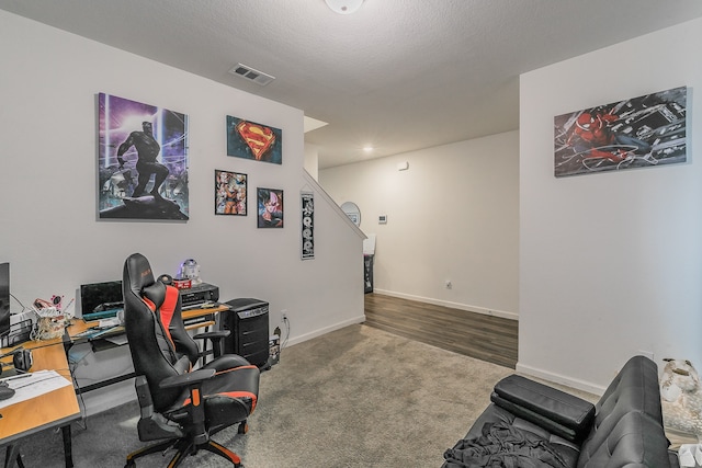 office space featuring a textured ceiling and hardwood / wood-style floors