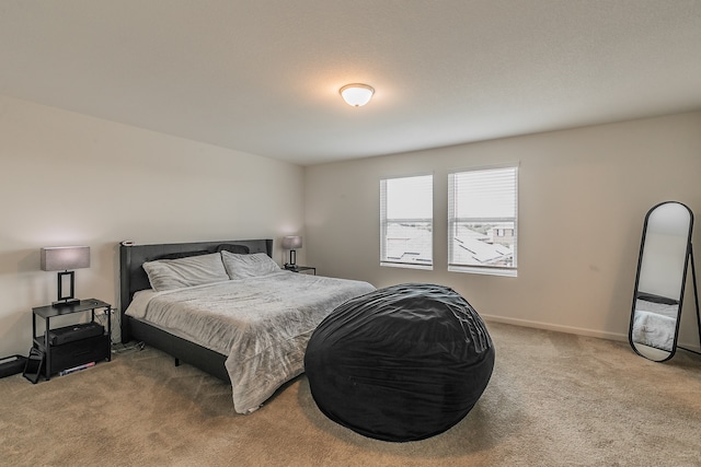 bedroom featuring light carpet