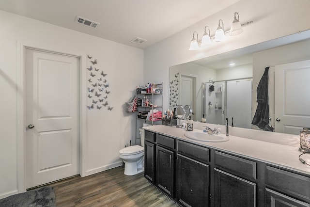 bathroom with vanity, toilet, hardwood / wood-style flooring, and a shower with shower curtain