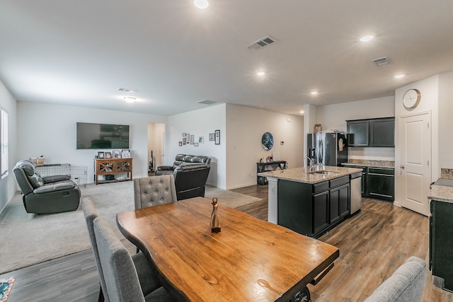 dining space with hardwood / wood-style floors